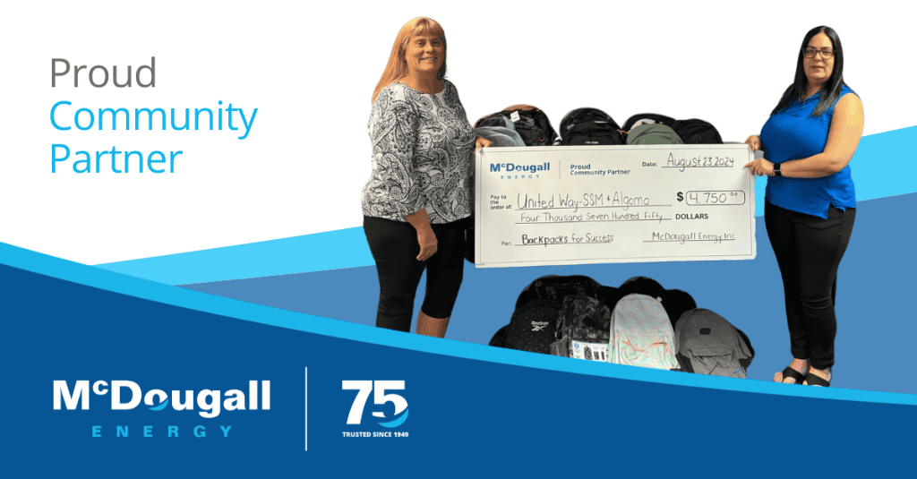 Photo of McDougall Energy representative with the United Way for a cheque presentation