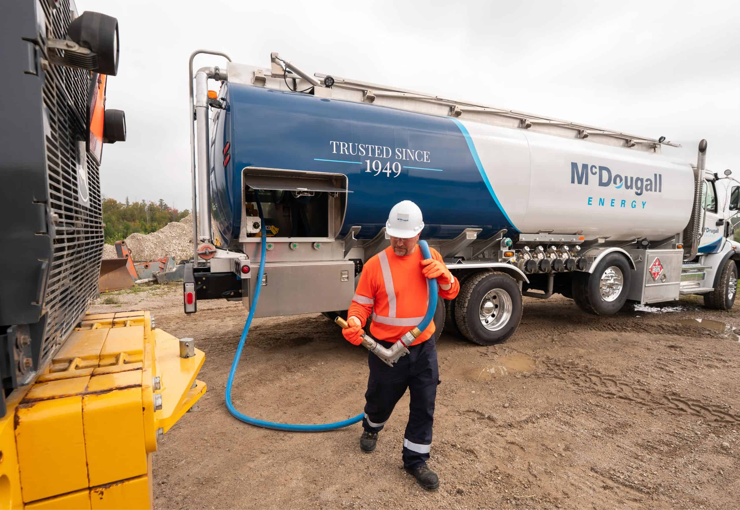 Fuel truck driver at McDougall Energy fueling station.