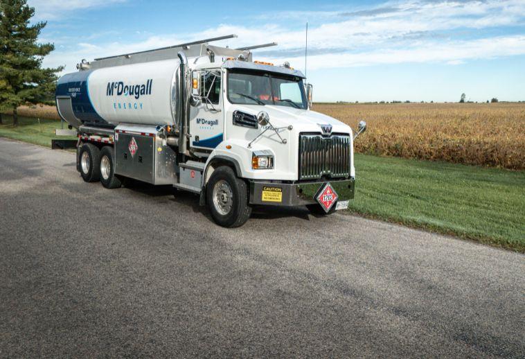 Refueling tanker truck providing propane and energy solutions for homes and businesses.