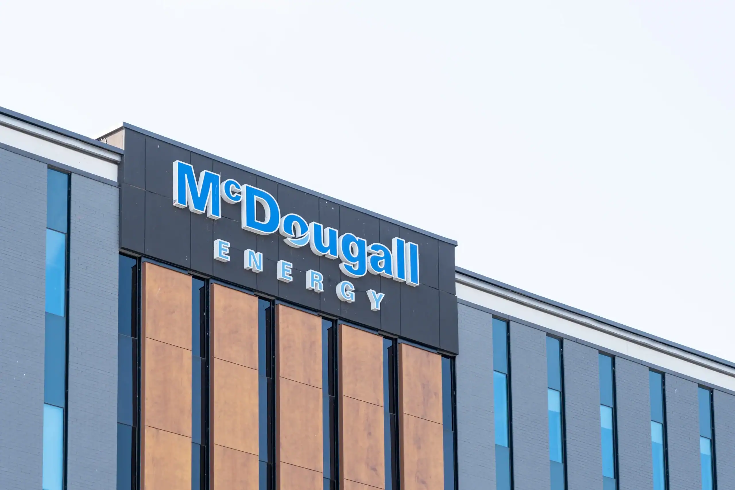 Exterior view of McDougall Energy office building in a modern commercial area.
