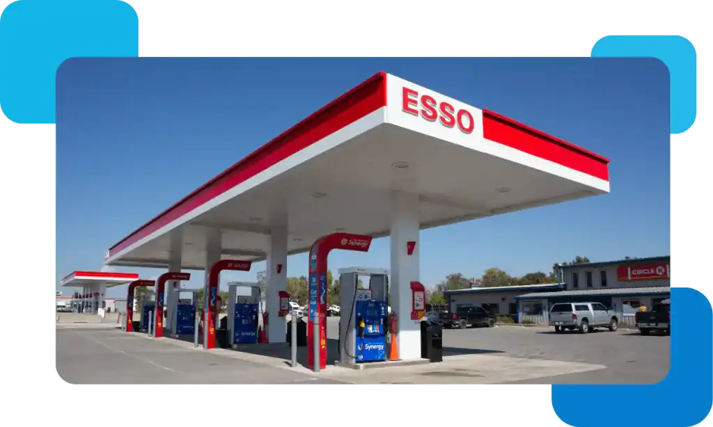 Convenient Esso gas station with fuel pumps and retail shop.