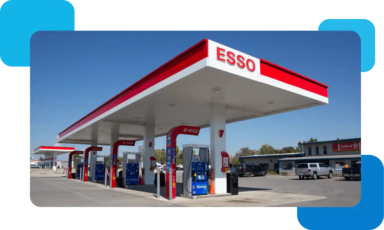 Convenient Esso gas station with fuel pumps and retail shop.