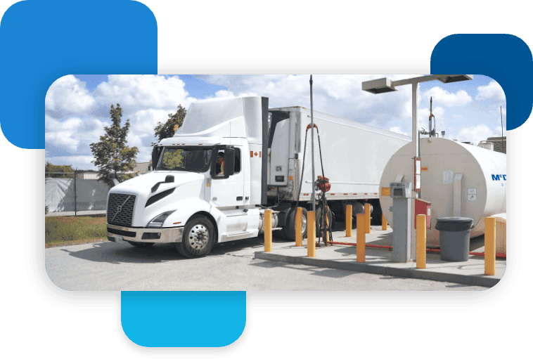 Fuel delivery truck at McDougall Energy fueling station, supplying gasoline and diesel.