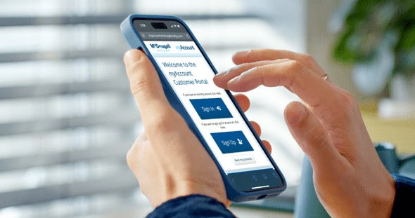 Person holding a phone and using it to access myAccount platform provided by McDougall Energy.